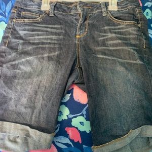 Dark woman’s denim Bermuda shorts